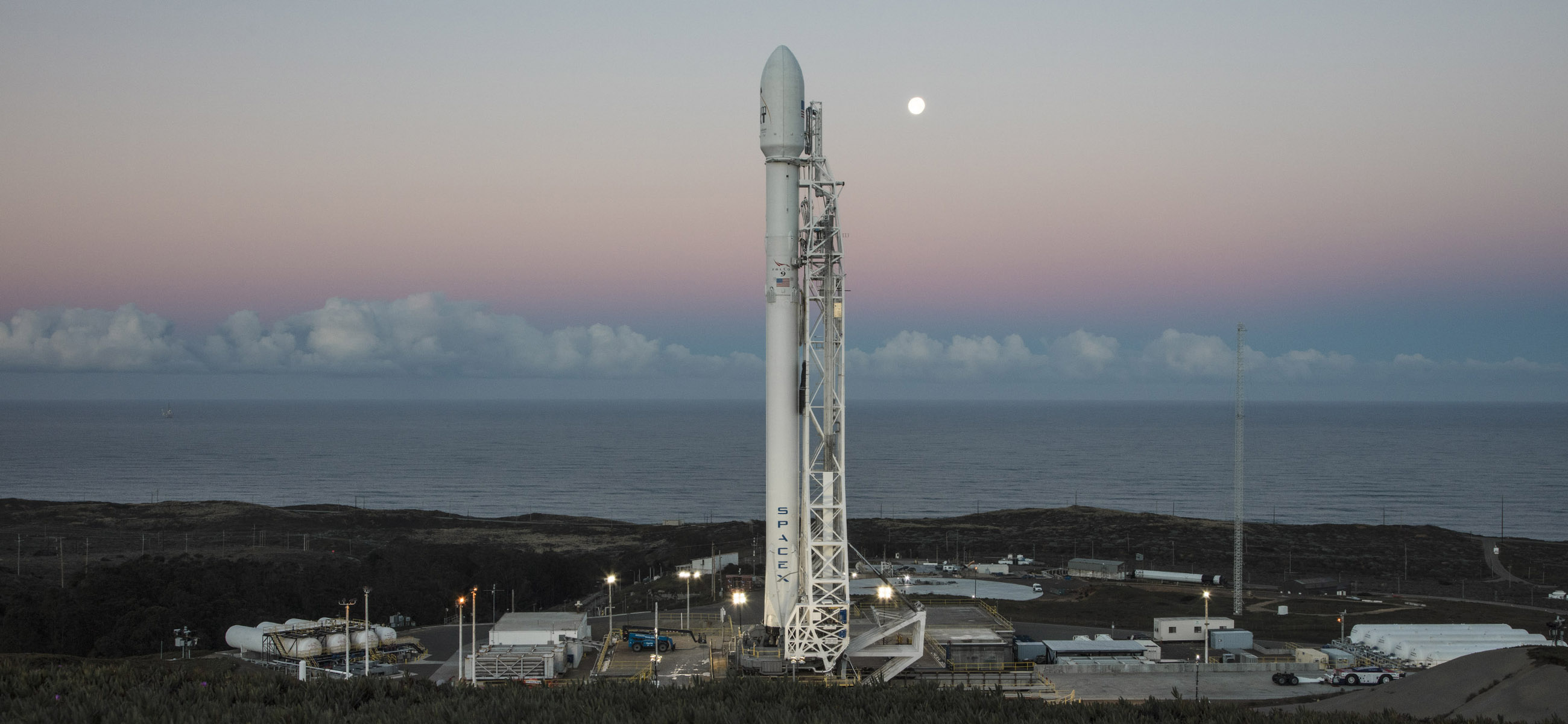 Falcon 9 vertical with its Iridium payload at moonrise