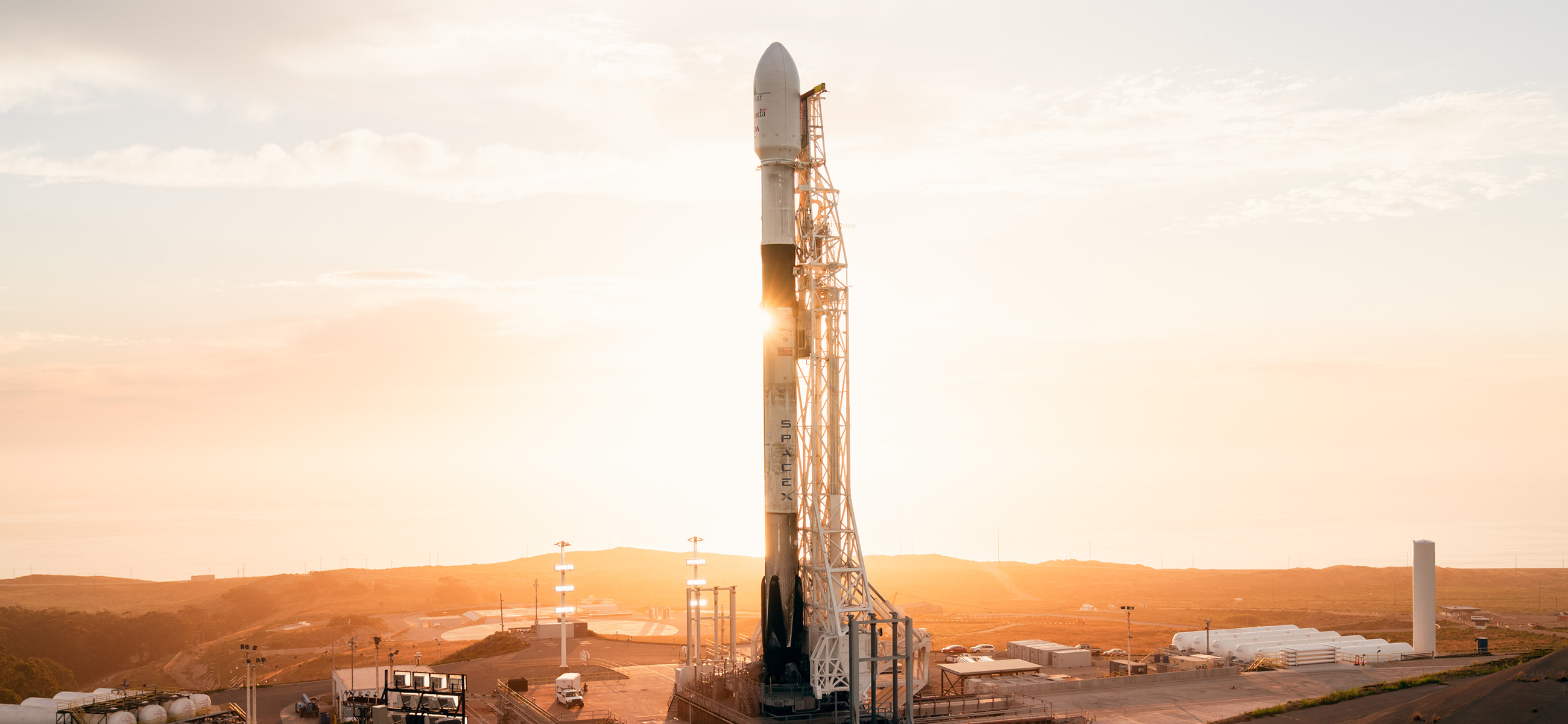 Falcon 9 with its Radarsat payload at sunset before launch